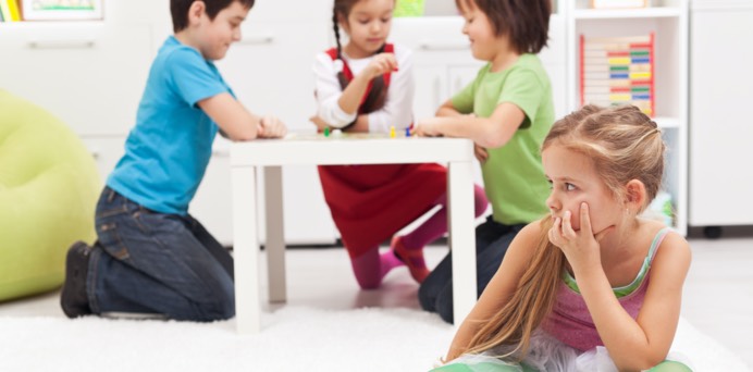 Children playing with one left out